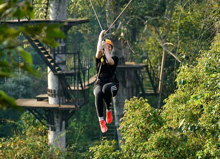 Experience the feeling of flying like a bird among the lush green trees, admiring the panoramic view of Angkor Park from a completely new angle